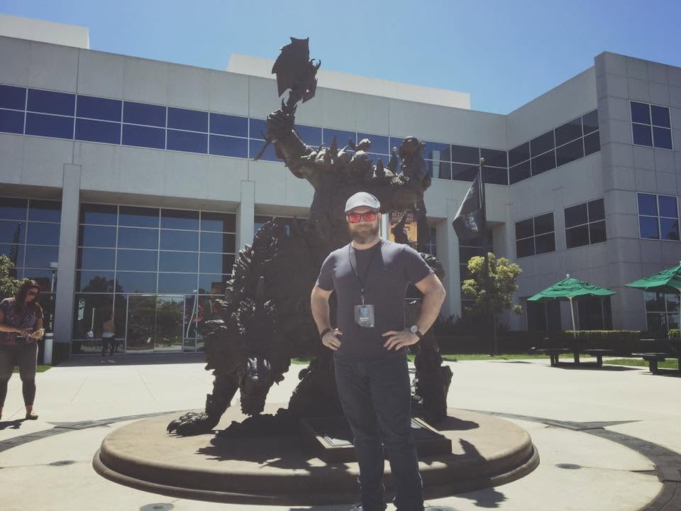 Devon standing in front of the large orc statue at the Blizzard campus